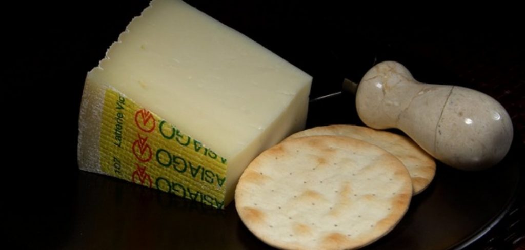 What does Asiago cheese taste like